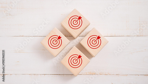 Target and Goal Setting Concept – Red Target Icons on Wooden Blocks