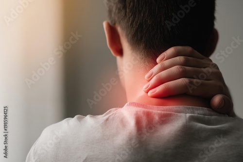 A person experiencing neck pain, highlighting the importance of self-care and wellness.
