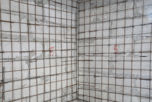 Wall made of limestone and rebar mesh. This image can be used as a background.