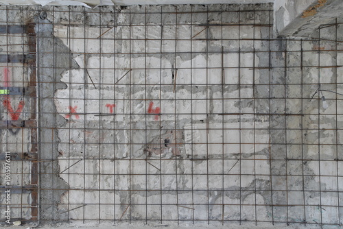 Wall made of limestone and rebar mesh. This image can be used as a background.