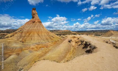 View of Castildetierra, the famous fairy chimney of the Bardenas Reales desert in Spain under cloudy sky