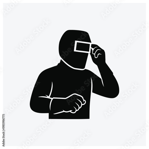 Silhouette of a person looking through binoculars or opera glasses.