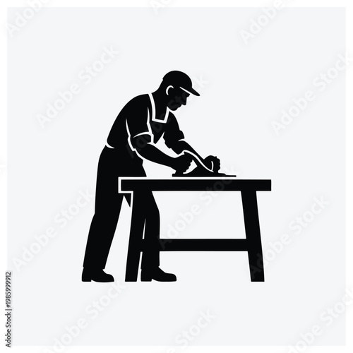 Silhouette of craftsman working at a table