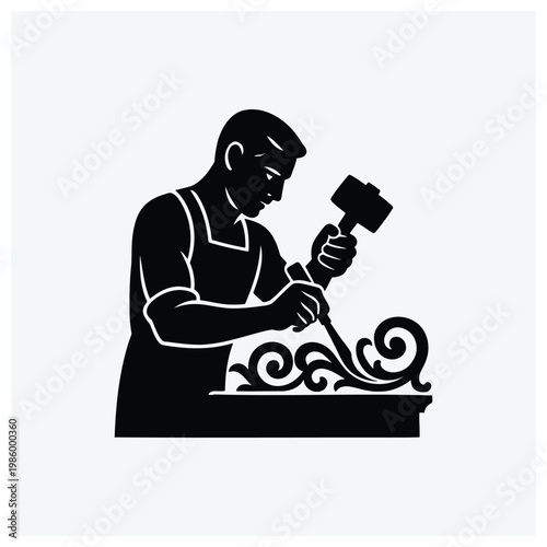 Silhouette of a sculptor carving art or statue