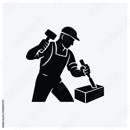 Construction worker using a hammer and tools on a box