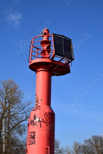 Reliable Red Navigation Aid Tower for Maritime Traffic in City Port Area