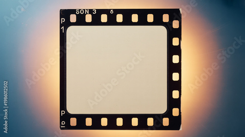 A film strip with a glowing background and a blank center for creative use