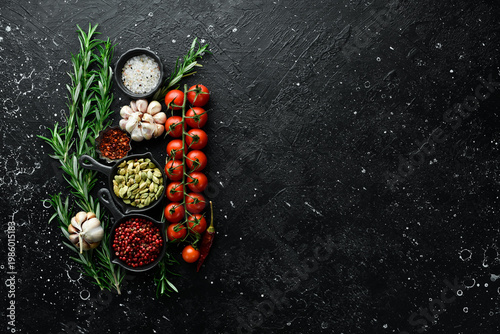 Cooking background. Fresh spices, rosemary and vegetables. Top view. Free space for text.
