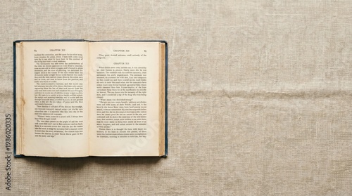 Open Vintage Book Chapter XII on Linen Background