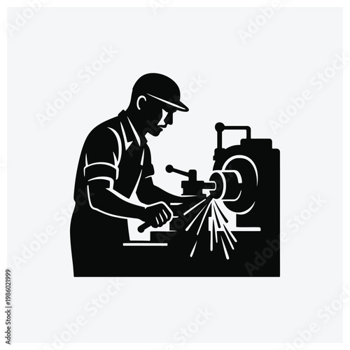 Machinist operating a machine shop lathe or industrial machining equipment