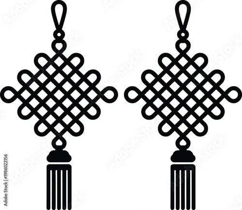 Intricate black metal earrings featuring traditional celtic knotwork designs with tassel accents