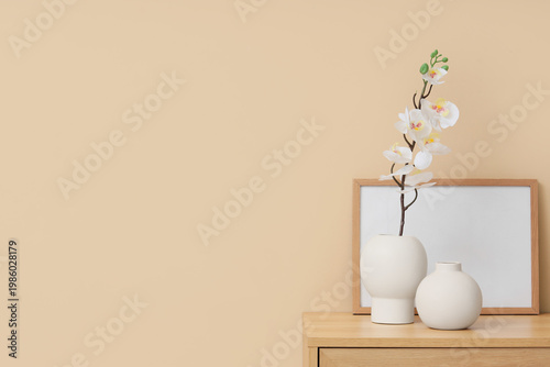 Vase with artificial orchid...