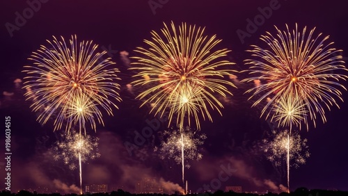 Vibrant fireworks display illuminating the night sky with golden explosions