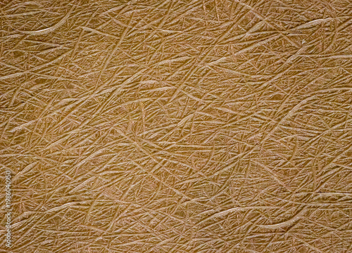 Eine Kunststoffstruktur in güldener Farbe.