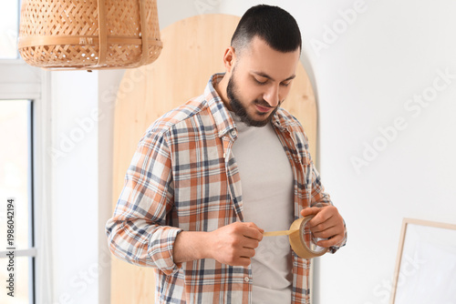 Young man with masking tape...