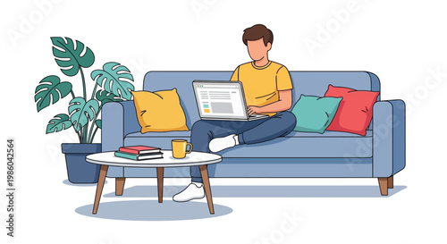 A man sits on a blue couch working on his laptop with a coffee table and plant nearby