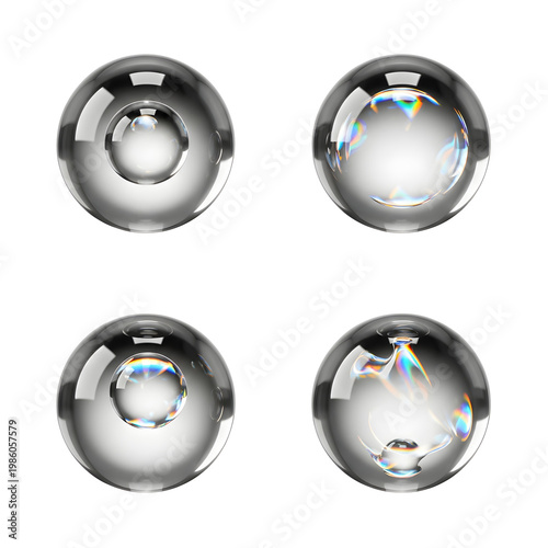 Four shiny reflective metal spheres closeup.