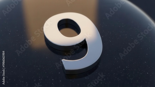 Shiny Metal Number 9 on Dark Textured Surface