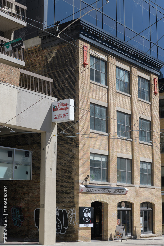 Obraz premium exterior building facade and sign of Yakiniku Legend, a restaurant, located at 35 McCaul St, Toronto (near Village by the Grange)
