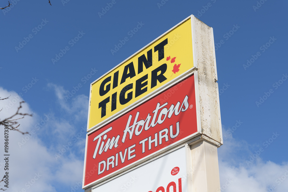 Obraz premium roadside pylon with Giant Tiger and Tim Hortons signs at 682 Kennedy Rd (Kennedy Park Plaza), Scarborough, Toronto