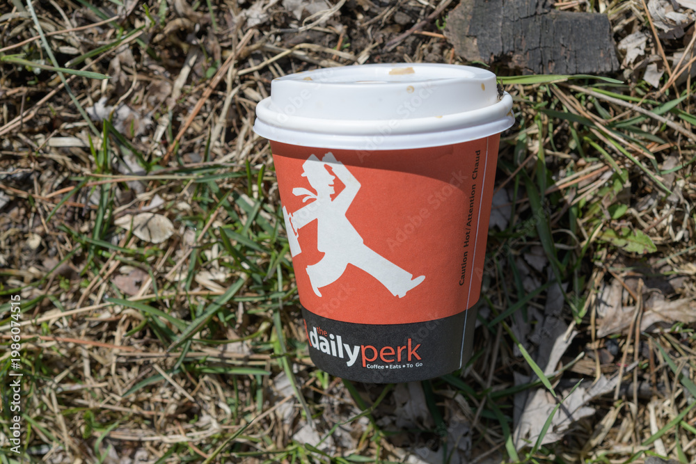 Fototapeta premium discarded beverage cup of The Daily Perk Coffee Co, a coffee shop (located at Victoria Park Subway Station, 777 Victoria Park Av), Toronto