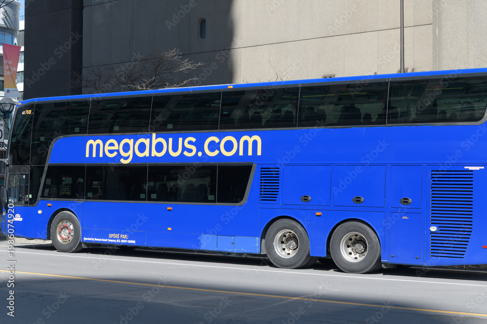 Fototapeta premium megabus dot com vehicle standing on Yonge St near Queens Quay, Toronto