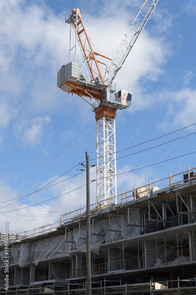 Obraz premium construction crane and building site of Nahid Kennedy, a 10-storey boutique condominium currently under construction at 615 Kennedy Rd (at Corvette Avenue), Scarborough, Toronto