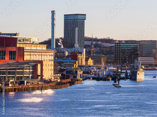 Buildings by the river in Gothenburg Sweden with ships and clear sky in the morning