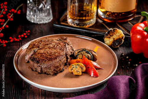 Tableau sur toile Grilled beef steak with vegetables and whiskey