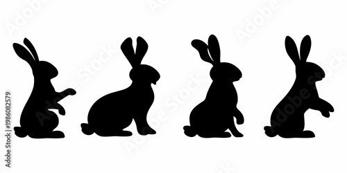 Four black silhouettes of rabbits in varying seated and alert poses
