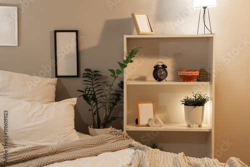 Alarm clock on shelf in bed...