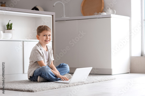 Cute little boy with modern...