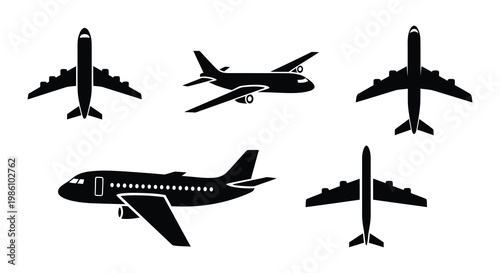 Collection of black silhouette airplane icons in various flight positions