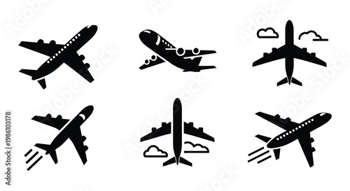 Collection of black silhouette airplane icons in various flight positions