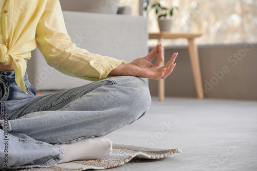 Young woman meditating on f...
