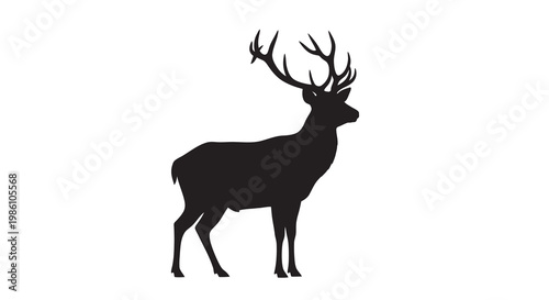 Silhouette of a majestic stag with large antlers facing left