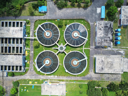 Obraz na płótnie Radial clarifiers at wastewater processing plant showing environmental infrastru