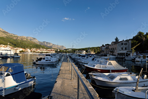 Port area with ships and yachts of Makarska on the Riviera, in Dalmatia in late summer