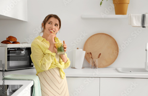 Young woman drinking lemona...