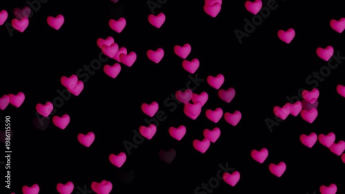 Valentine pink heart shapes floating upwars on blackground