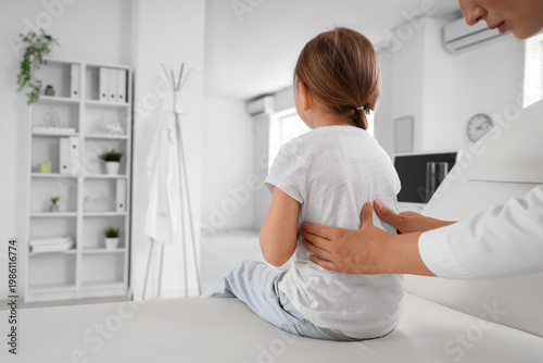 Female osteopath working wi...