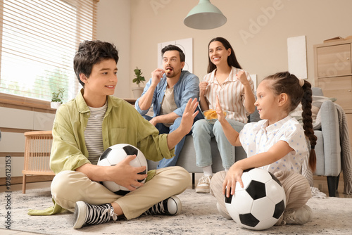 Kids with soccer balls givi...