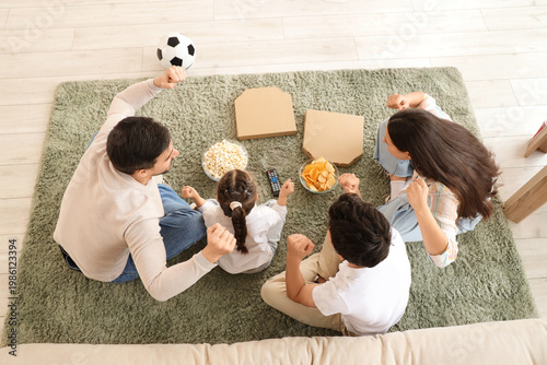 Happy family with soccer ba...
