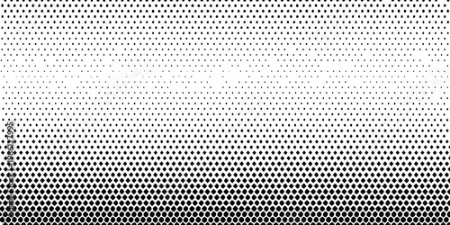 Gradual halftone dot pattern transitioning from dense to sparse distribution