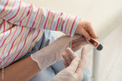 Female pediatrician with li...