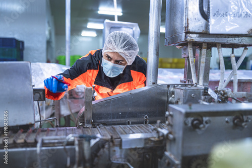 Photography Food and manufacturing researchers oversee seafood production lines in tightly controlled factories where machinery is used to produce and cook food before it is shipped out
