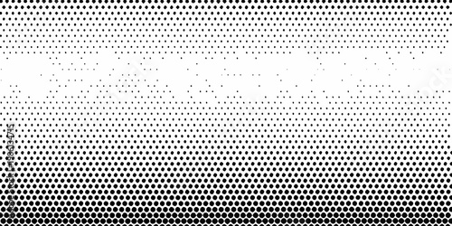 Abstract halftone pattern transitioning from dense to sparse dots