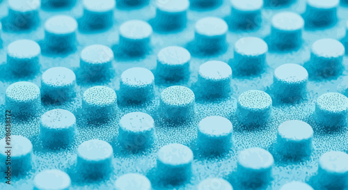 Abstract blue texture with repeating cylindrical shapes and granular surface