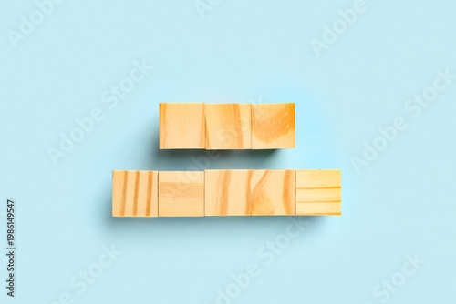 Wooden cubes on blue backgr...
