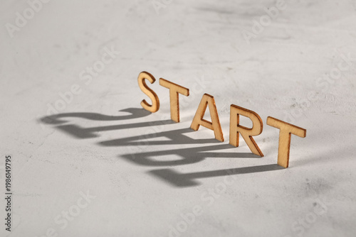 Word START with shadow on g...
